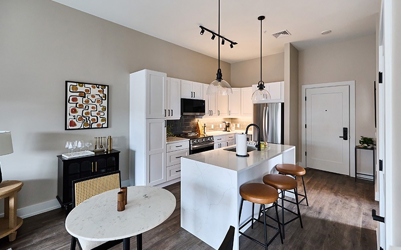 Kitchen and living room in the model unit at River House at The Waterfront in Allentown.