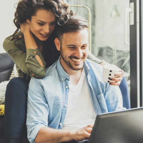 a couple looking at a computer together