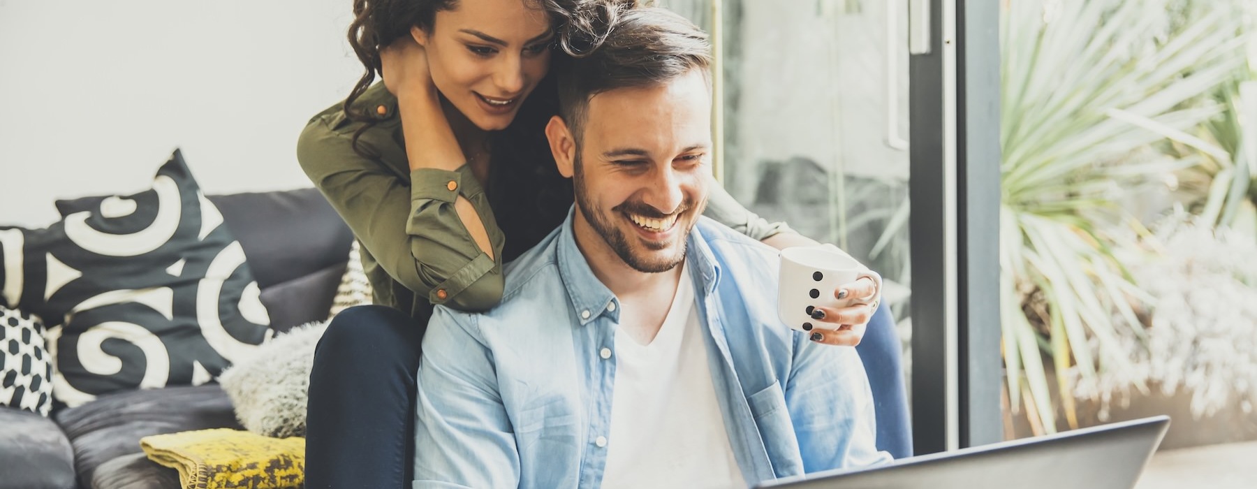 a couple looking at a computer together